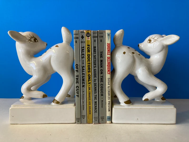 Image of two vintage white ceramic deer bookends