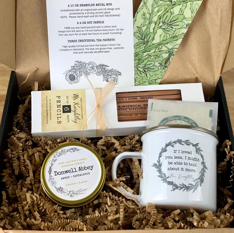 photo of an Emma inspired gift set with a mug, a candle, some tea bags, and pencils