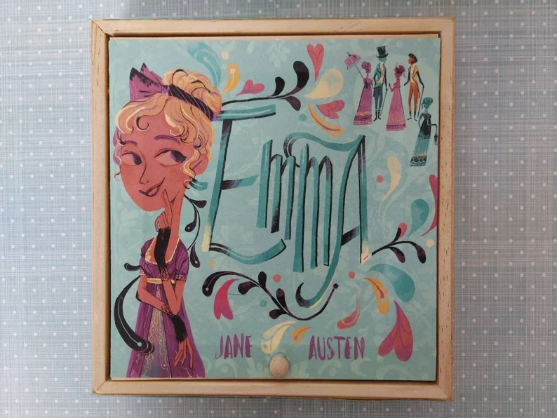 photo of a jewellery box adorned with a hand painting depicting Emma, the name and Jane Austen, as well as some other characters in the corner