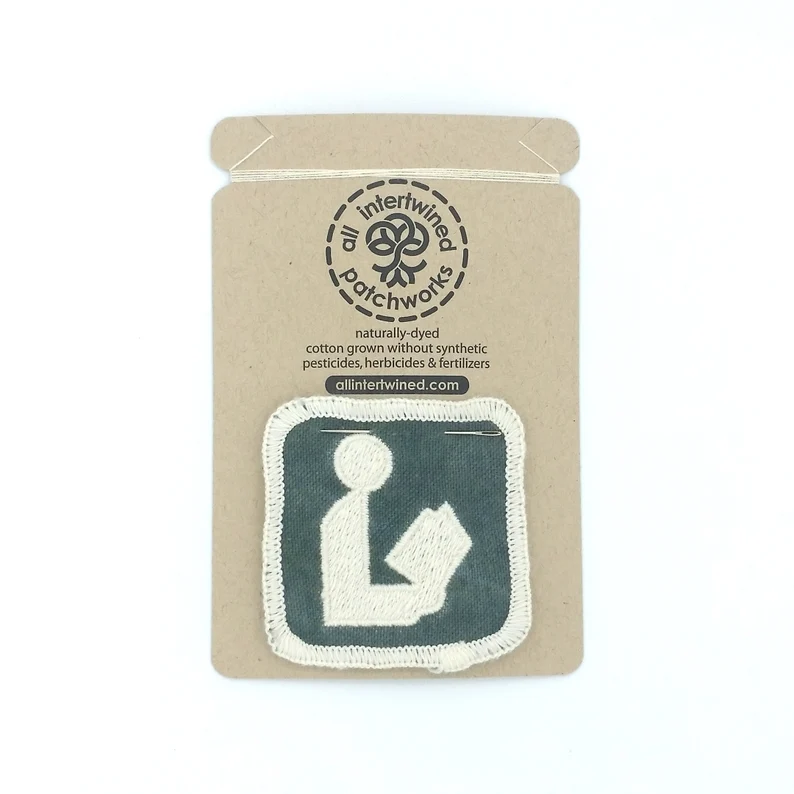 Image of a patch with the library symbol on it. 