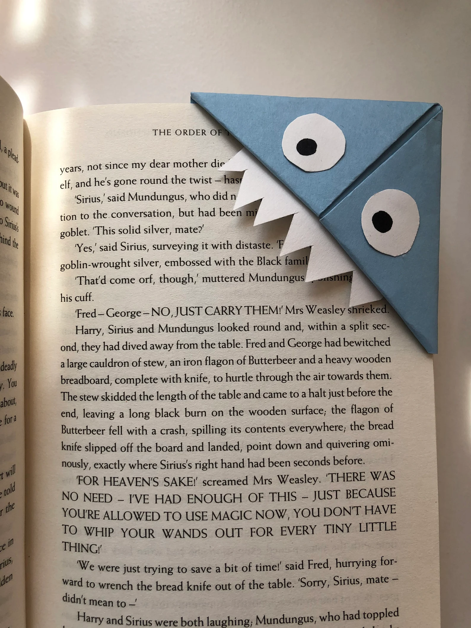 Origami corner bookmark in the shape of a monster