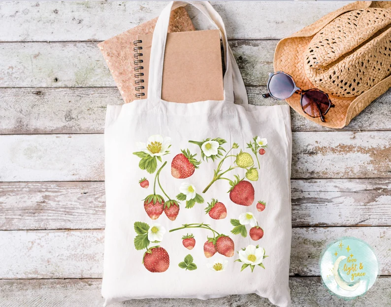 Canvas tote bag with strawberries on it. 