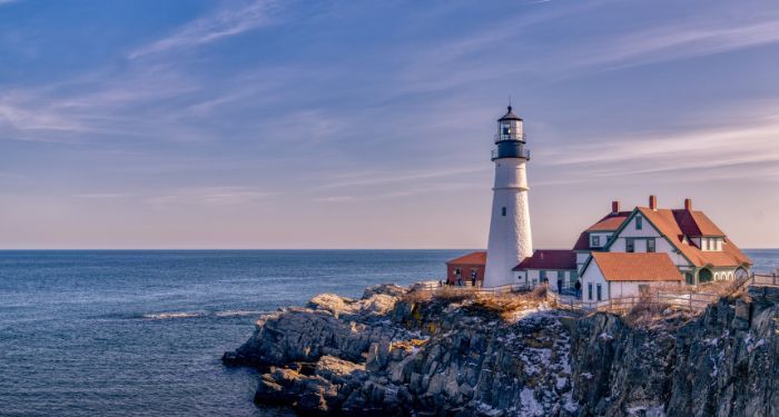 a lighthouse looking out over a large expanse of water