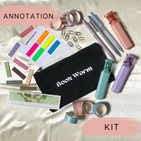 An annotation kit including a black bag that says "book worm", pen, highlighter, washi tape, transparent sticky notes, book clips, and more.