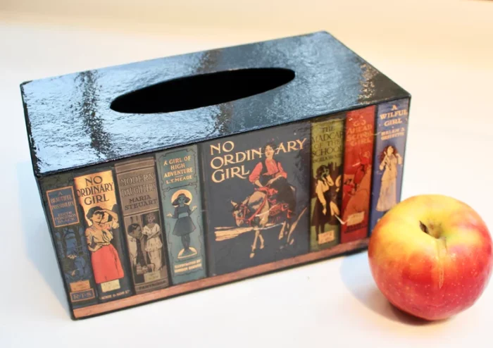 Tissue box holder with children's books on it