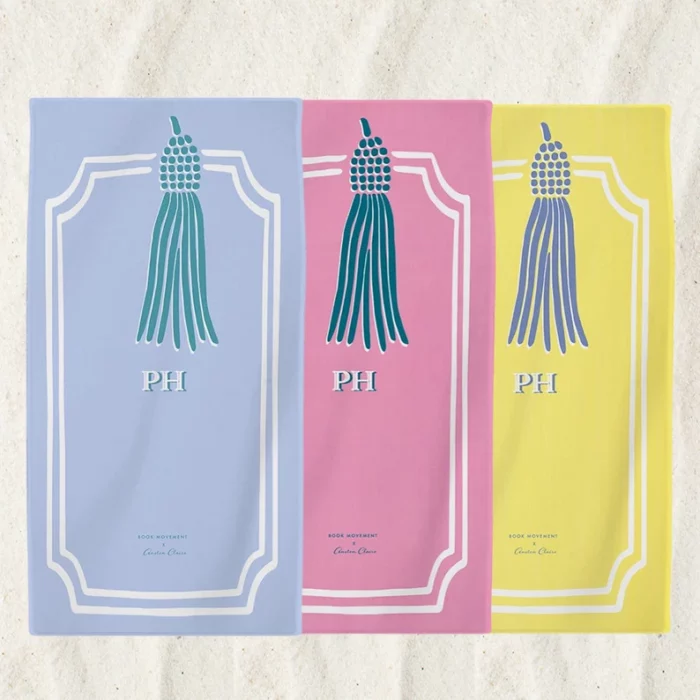 Beach towels shaped like bookmarks with monograms on them.