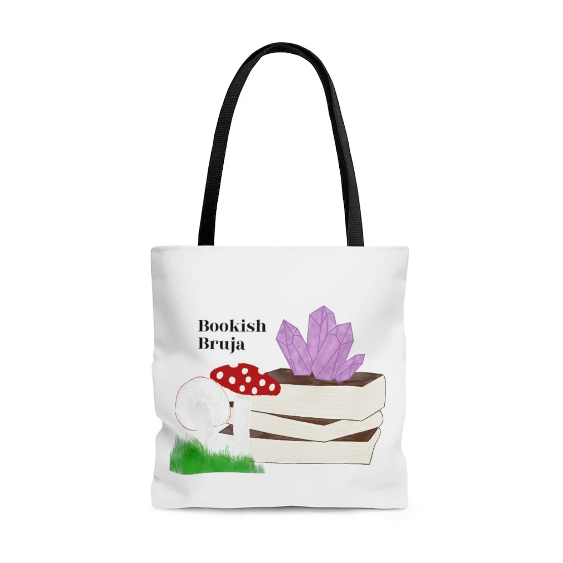 Image of a white tote bag with books, crystals, and mushrooms on it. It reads "bookish bruja."