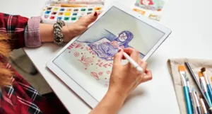 a photo of a white woman drawing a cartoon on a tablet
