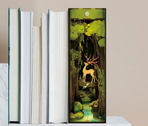 Image of wooden booknook with forest scene and deer