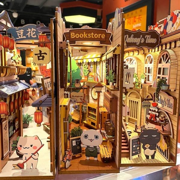 three booknooks showing Cat Stores with cat cartoon figures