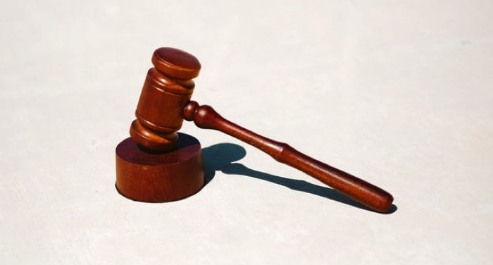 wooden gavel against a white background