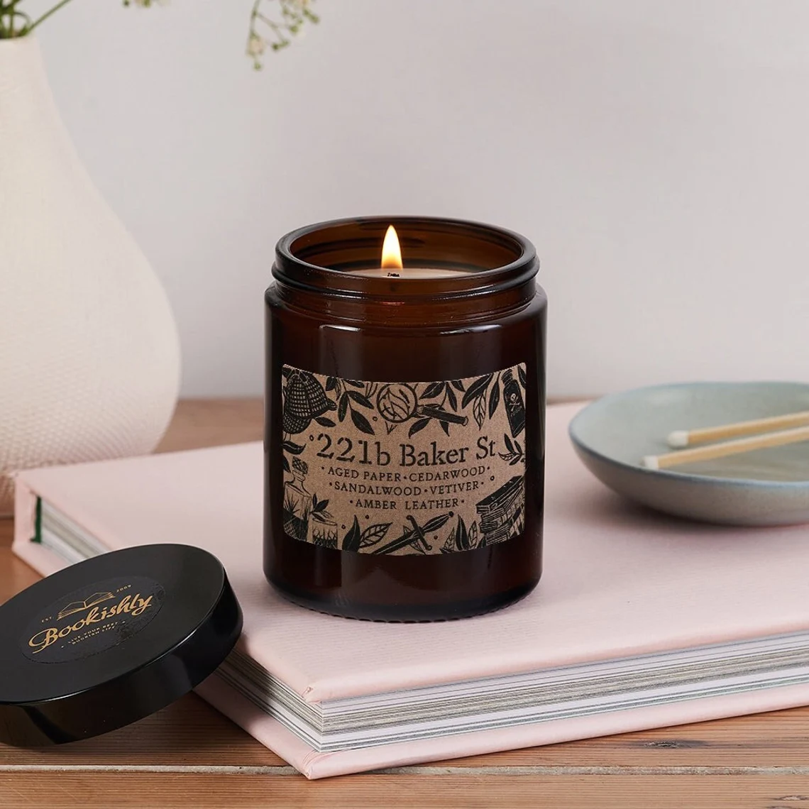 photo of a candle inspired by 221 B Baker Street with notes of aged paper, cedarwood, sandalwood, vetiver, amber, and leather