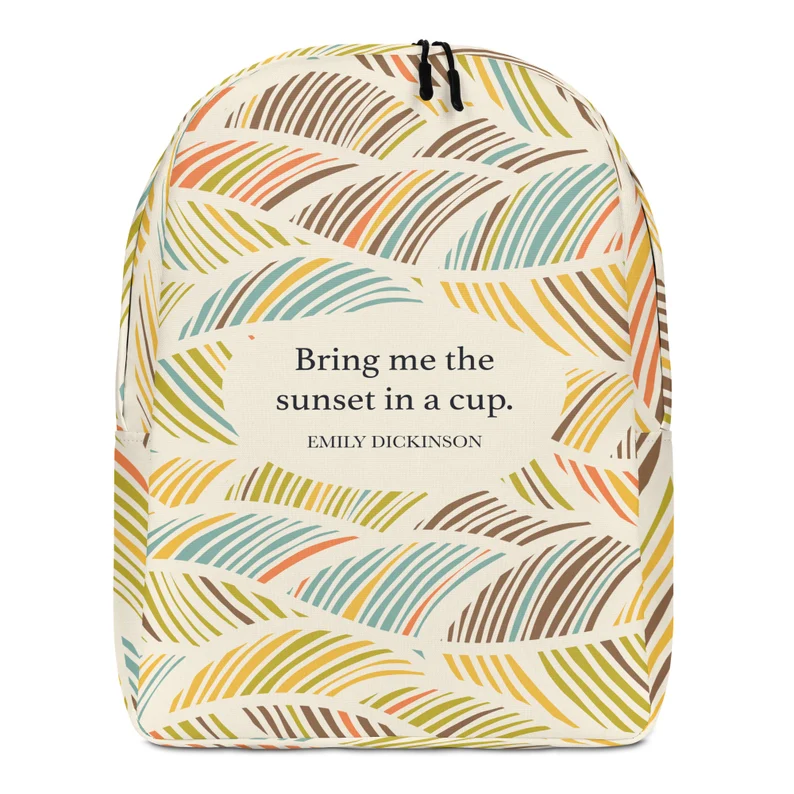 picture of a blue, yellow, red, and brown patterned backpack with the Emily Dickinson quote, "Bring me the sunset in a cup." in the center