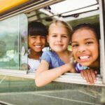image of kids on a school bus