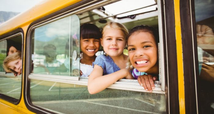 image of kids on a school bus