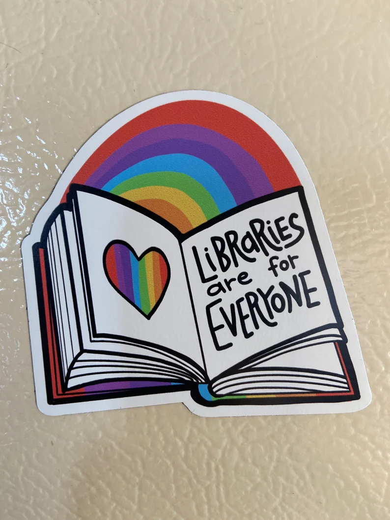 image of a magnet that is an open book and says "libraries are for everyone."