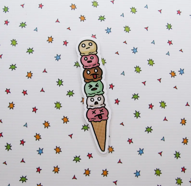 Image of a bookmark that has six colorful scoops of ice cream on a cone. Each scoop has a silly face. 