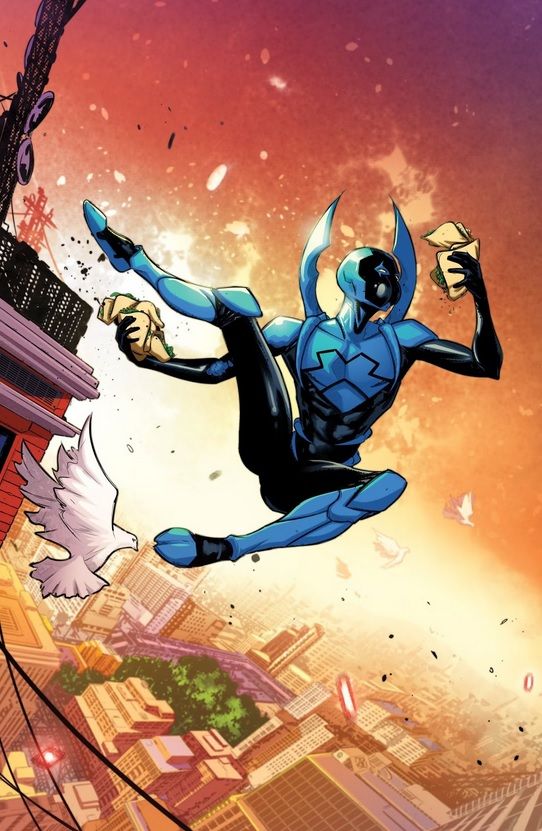 Young Justice: Targets Hispanic Heritage Month cover. Blue Beetle is jumping through the air while chowing down on at least half a dozen tacos.