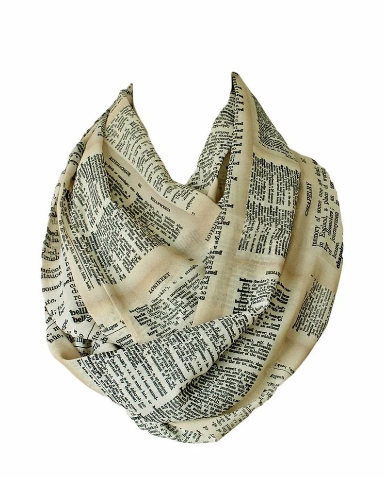 an infinity scarf printed with dictionary pages