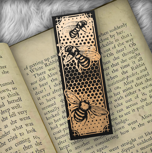 black and gold bookmark wtih a honeycome print and bees