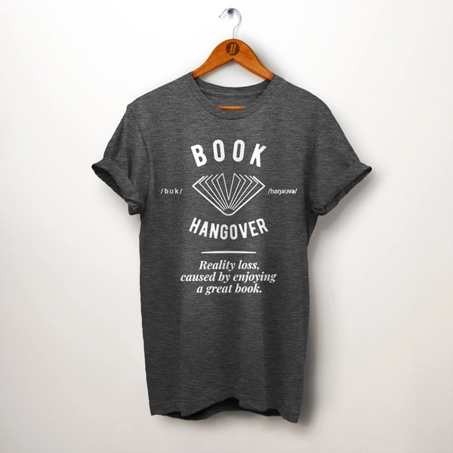 a gray t-shirt with a book on the cover and the definition of "book hangover" written out