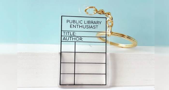 A clear plastic keychain in the shape of a library card.