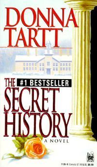 mass market cover of the secret history by donna tartt; image of a snowy campus, a Greek column, and a rose