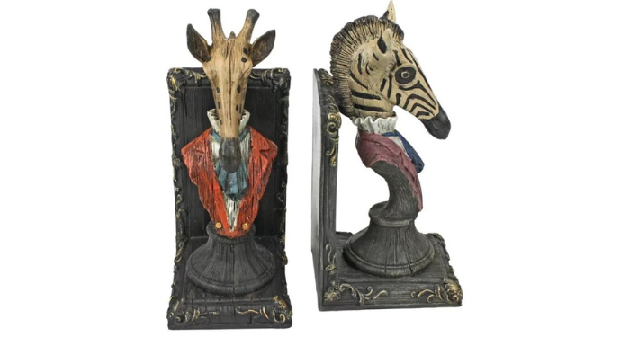 a photo of giraffe and zebra bust bookends wearing vintage clothing