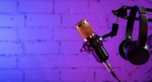 microphone and headphones on purple background