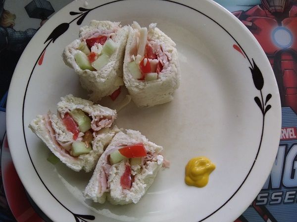 Author photo of four rather crude sandwich rolls with a blob of mustard for dipping