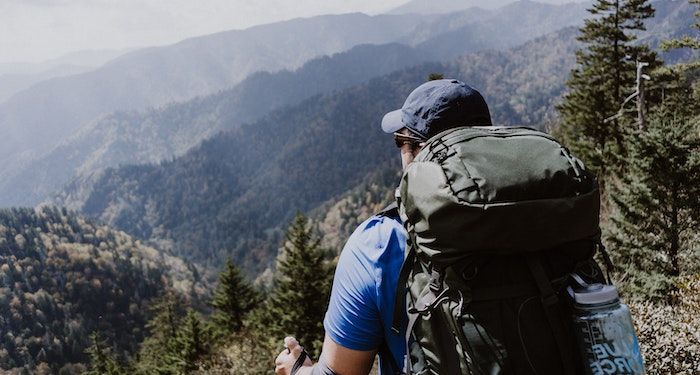 a photo of a hiker looking at the Great Smoky Mountains