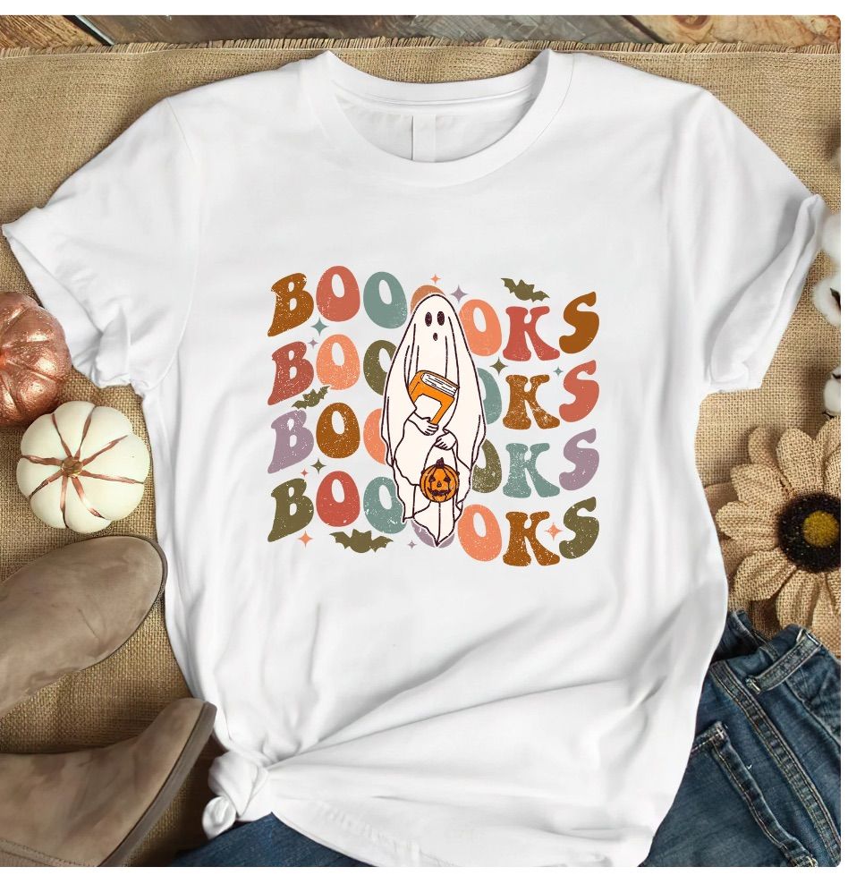 Image of a white shirt with the word "boooks" in wavy letters. There is an image of a ghost in the center. 