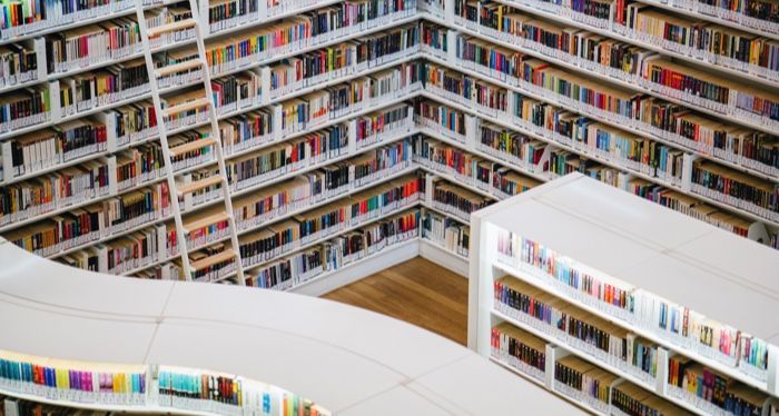 curved white library shelves