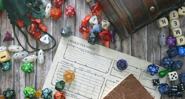 a photo of a D&D character sheet surrounded by dice