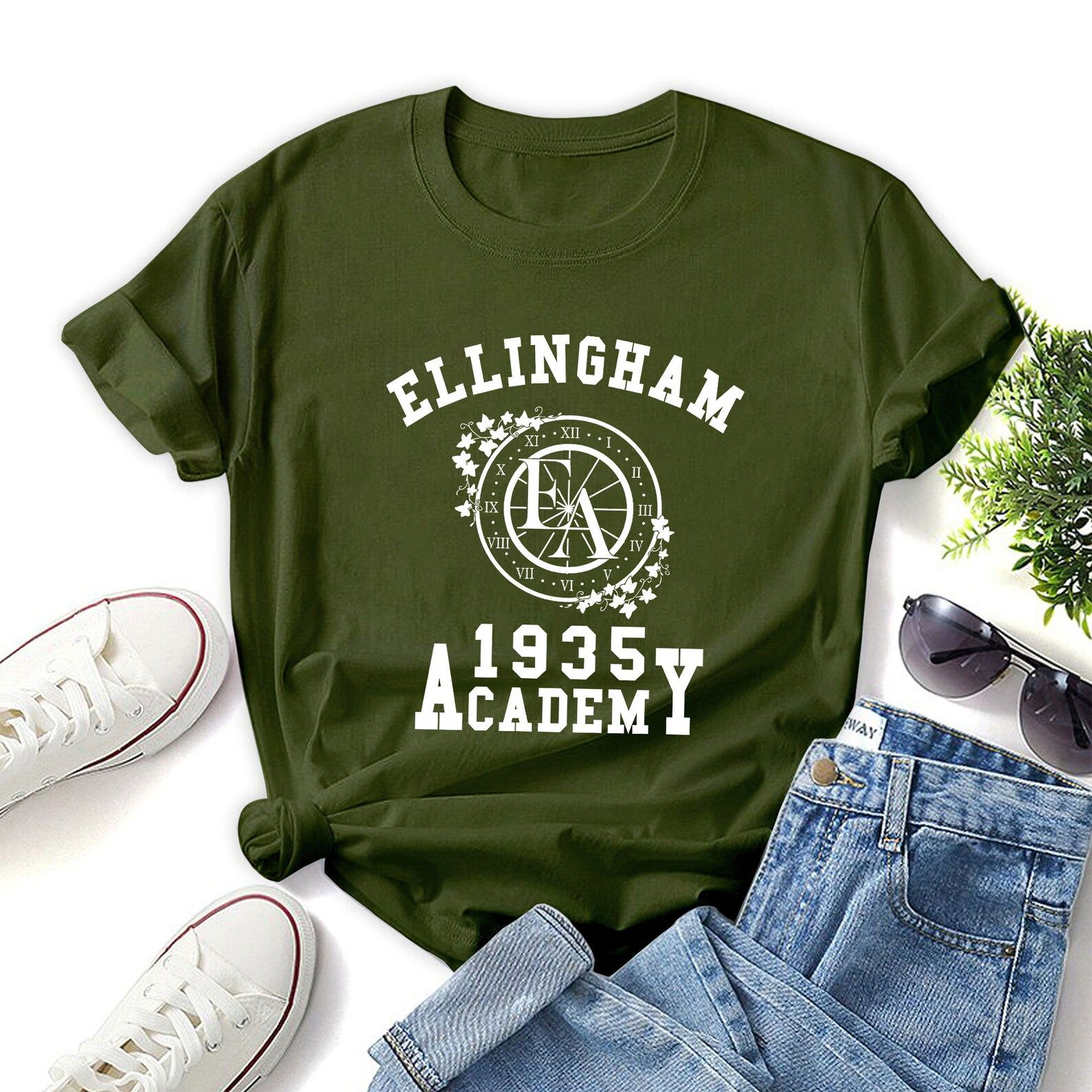 Green t-shirt that reads "Ellingham Academy, Est. 1935"