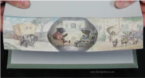 a photo of a fore-edge painting on Wind in the Willows, done by Martin Frost