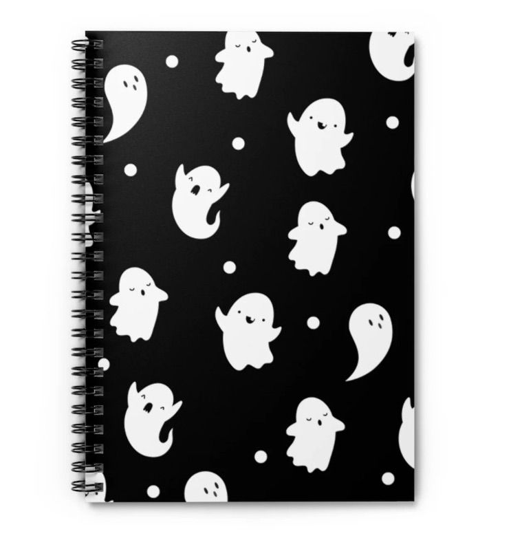 Black notebook with white ghost pattern.