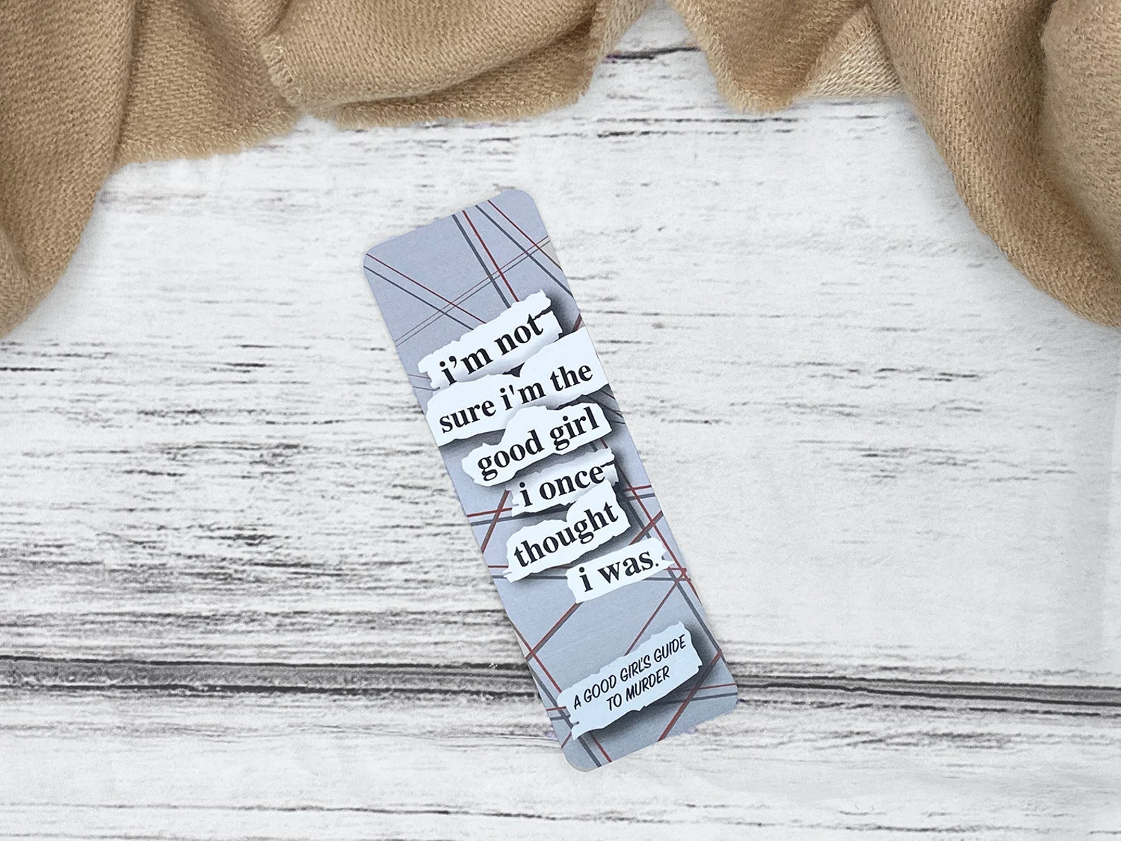 A bookmark that reads "I'm not sure I'm the good girl I once thought I was"