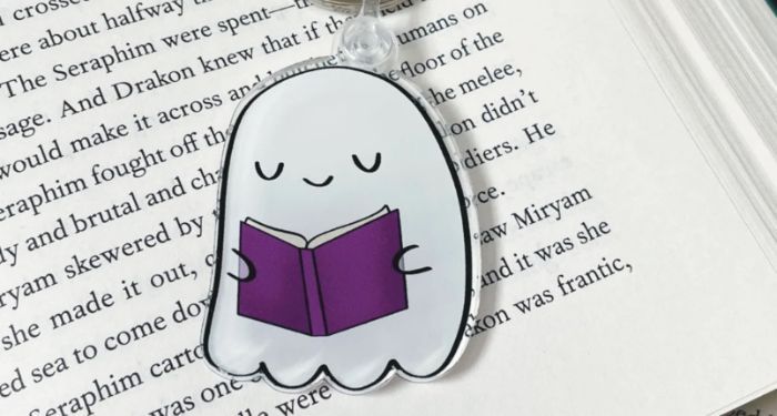 Image of a ghost reading a book