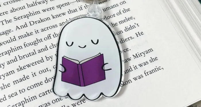 Image of a ghost reading a book