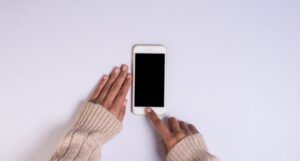 Image of Black hands using a phone