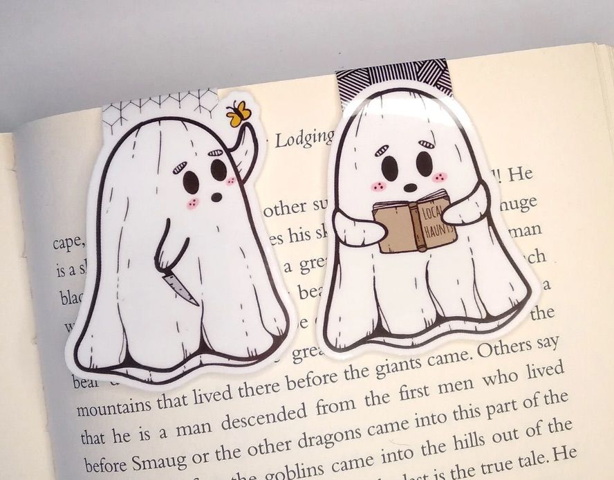 Image of two magnetic bookmarks in the shape of ghosts. 