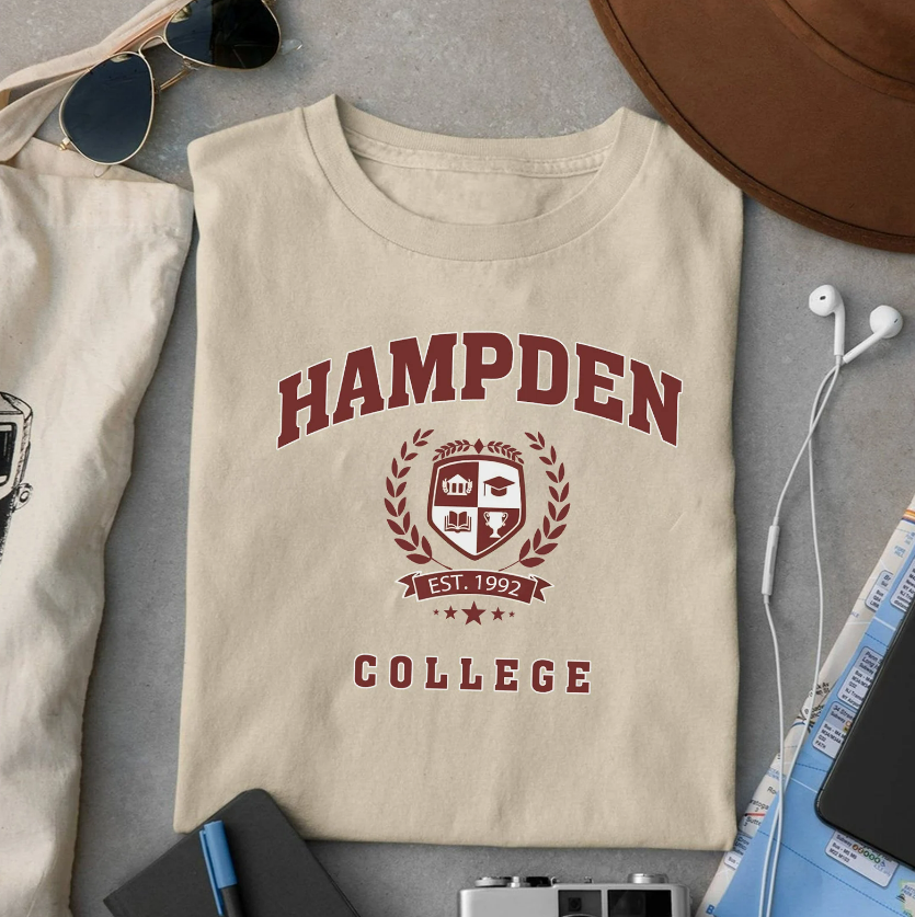 tshirt with the logo of Hampden College, the school where The Secret History takes place 