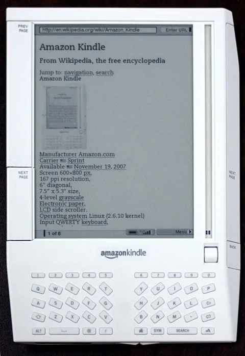 a picture of the Amazon Kindle First Generation with a grainy screen and a keyboard