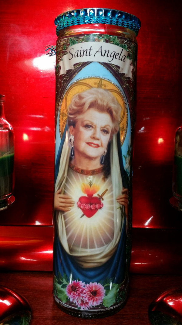 a prayer candle with an image of Angela Lansbury