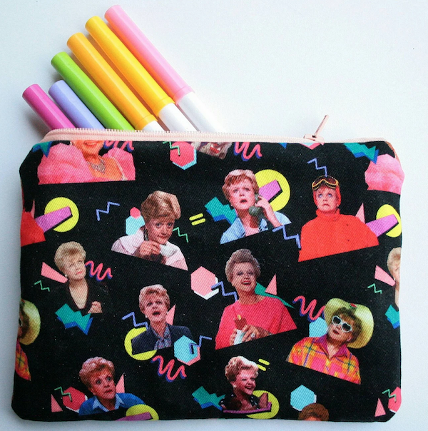 small pouch case with images of Jessica Fletcher printed on black fabric