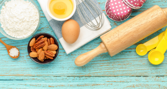 a photo of baking equipment and ingredients on a blue table