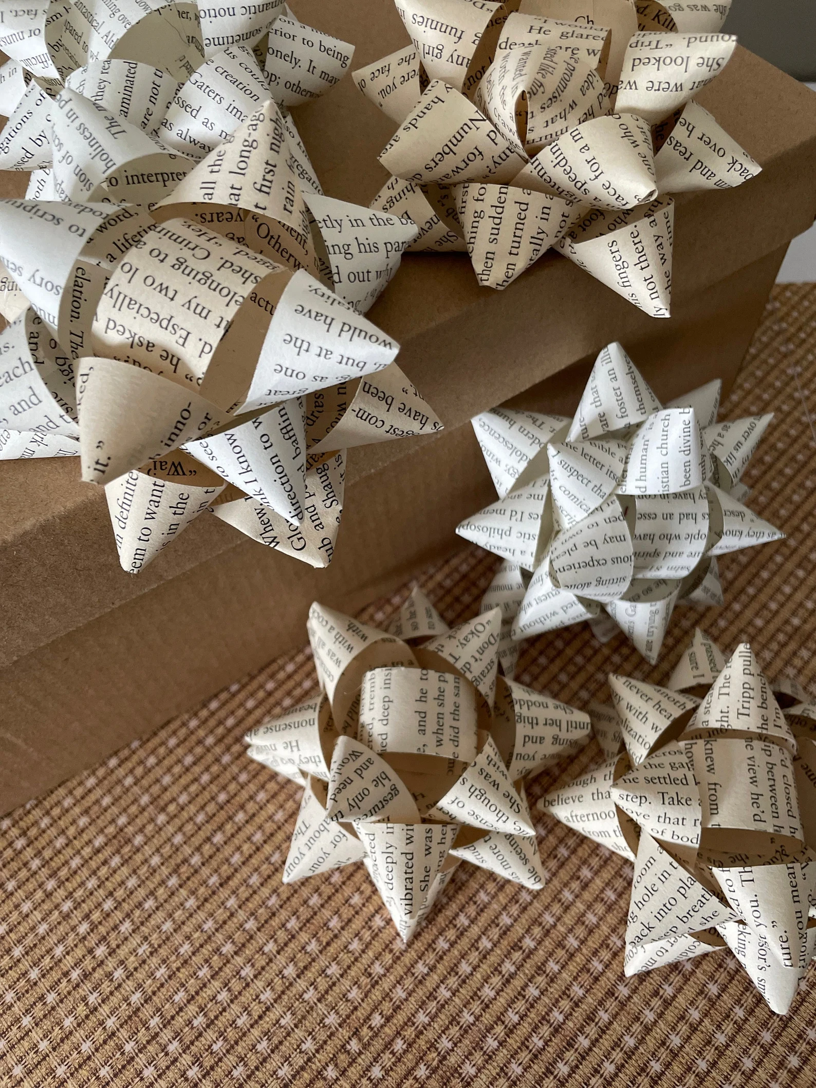 a pile of gift bows made out of old book pages