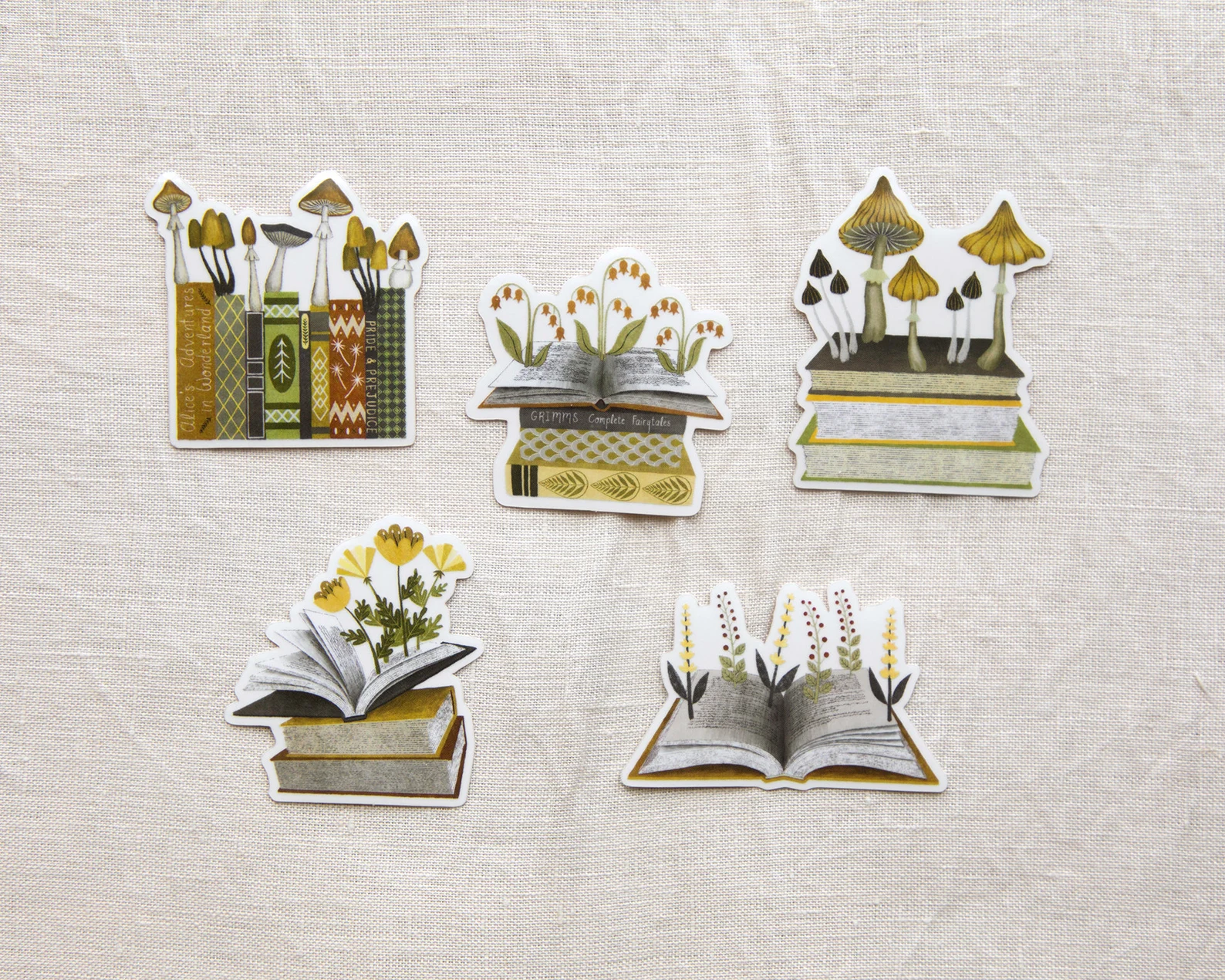 a collection of stickers featuring books and flora and fauna in earth tones
