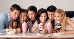 a promo image showing Friends characters sharing two milkshakes